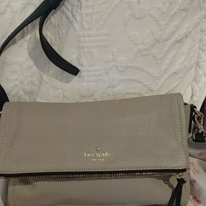 8 by 11 1/2 which could be made an inch or two longer. Kate Spade grey handbag.